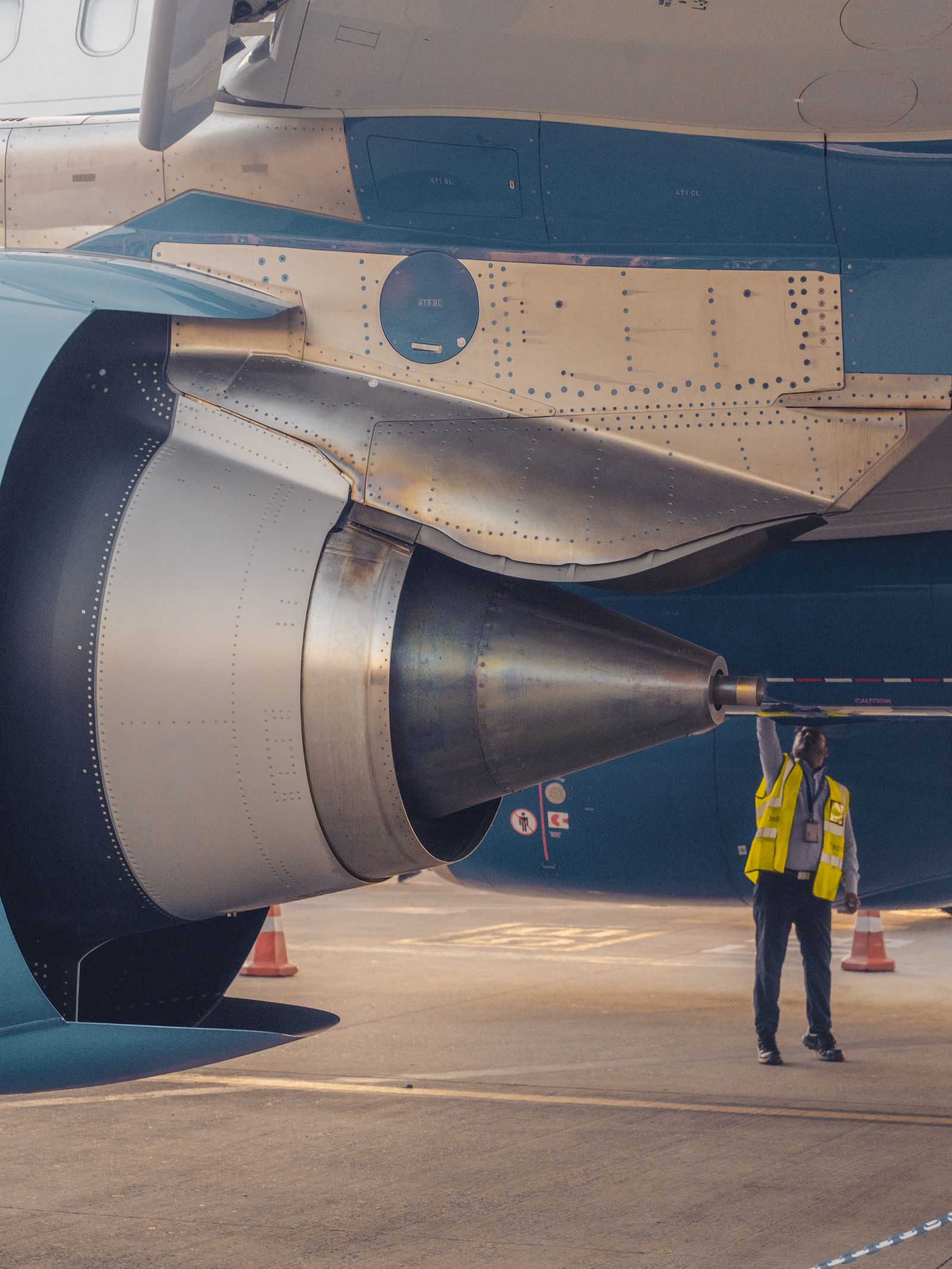 Aviation safety specialist inspecting an aircraft engine